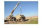 A mobile crane uses a pulley and other simple machines to lift a tank.Image by Wikimedia commons/Flickr upload bot