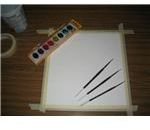 Watercolor paper, brushes and paint