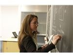 800px-Teacher writing on a Blackboard