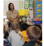 514px-US Navy 090303-N-3666S-011 Boatswain's Mate 2nd Class Rasheema Newsome, assigned to Commander, Navy Region Hawaii, reads Dr. Seuss' The Cat in the Hat to kindergarten students at Lehua Elementary School