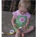 Stringing donut shaped objects