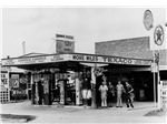 800px-StateLibQld 1 146191 Workers pose at Grange Garage, Brisbane, ca. 1941