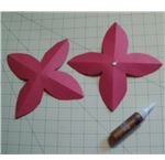 put a dot of glue on the bottom petal center