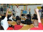 800px-US Navy 090320-N-3666S-147 Capt. Ricks Polk, commanding officer of Afloat Training Group Middle Pacific answers questions from students during a Career Day at Iroquois Point Elementary School