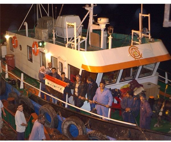 750px-workers on Al Basrah Oil Terminal (ABOT) boarding an Iraqi tug boat to go ashore to cast their ballots for Iraqi election during the early morning