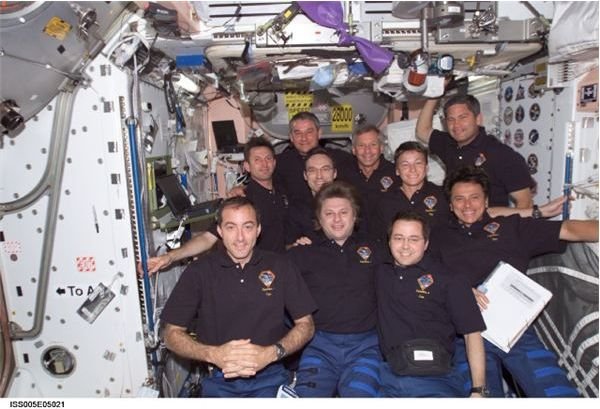 Crews of Expeditions 4 and 5 as well as STS-111 in a group picture
