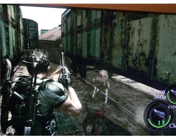 Chris and Sheva are attacked by infected dogs in a trainyard, during Resident Evil 5.
