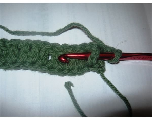 Making a front post double crochet (FPDC) stitch.