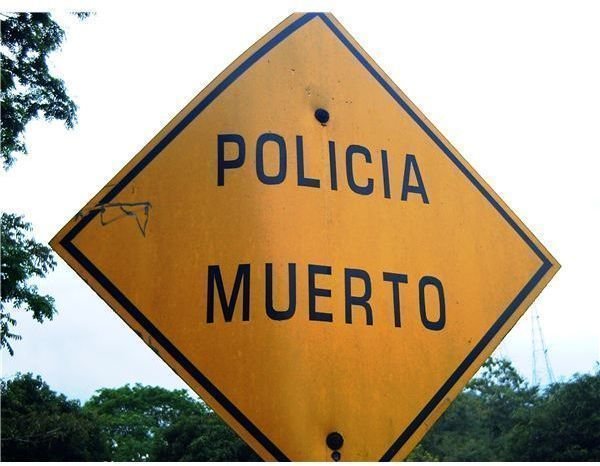 Policia Muerto sign