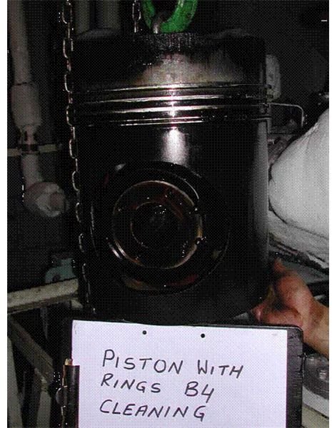 piston with rings before cleaning