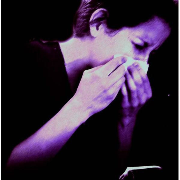 591px-Woman sneezing