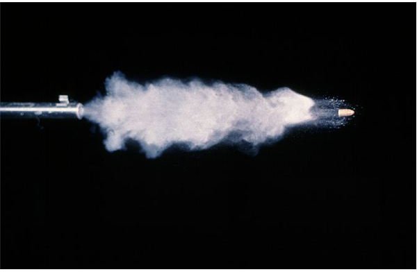 .22-caliber gun firing a bullet - by Andrew Davidhazy