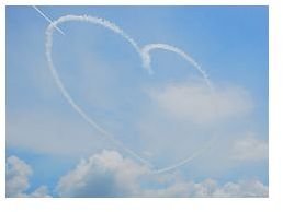 An aerial maneuver with smoke trails in the shape of a heart.