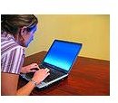 120px-Woman-typing-on-laptop