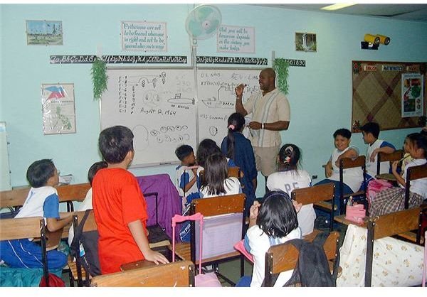 800px-US Navy 020719-N-3446M-008 Volunteer meets with Philippine children at a Special Education Center for gifted children