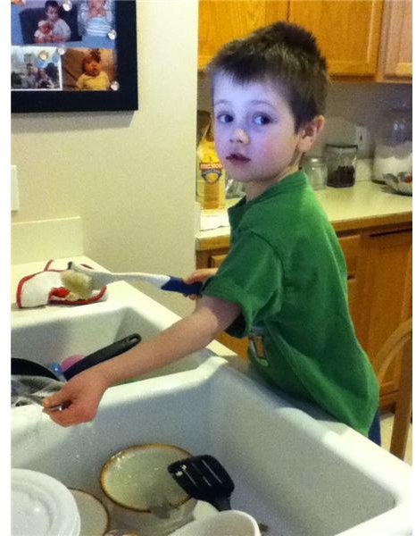 Helping wash the dishes.