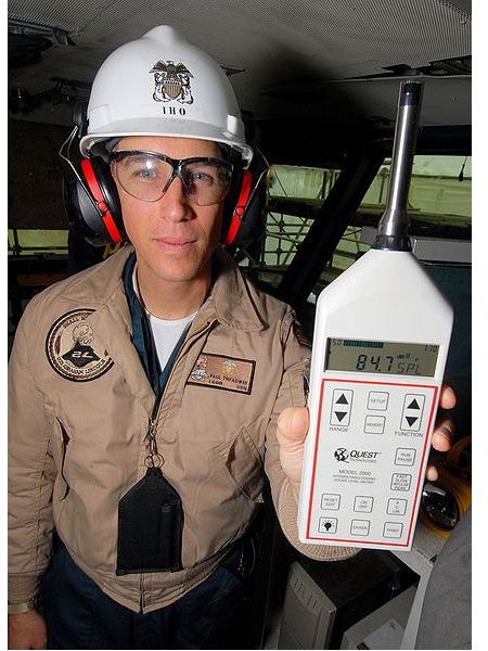 Industrial Hygene Officer and Assistant Safety Officer uses a sound level meter to demonstrate the high deci