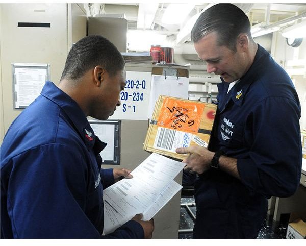 777px-US Navy 101116-N-3666S-079 Logistics Specialist 2nd Class Travis Bradford, left, and Logistics Specialist 1st Class Todd Tudor (1)