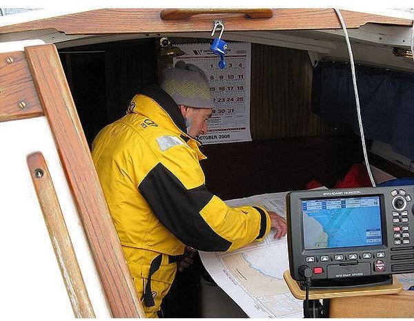 A sailor prepares for his next seafaring adventure using his marine GPS device.