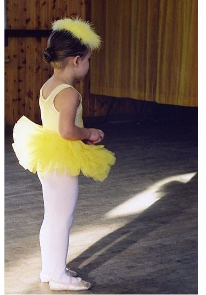 Little girl in yellow tutu