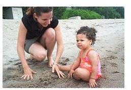 Mom and daughter on the beach.