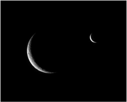 Rhea and Enceladus Crescent - Image courtesy of NASA