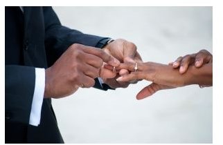An African American couple exchange rings