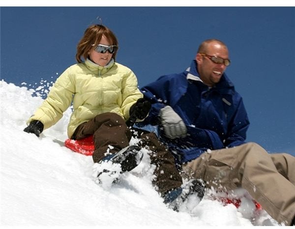 Father and daughter in the snow.