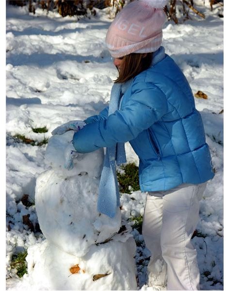 Girl Playing In Snow