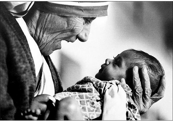  Mother Teresa cradling an armless baby orphan