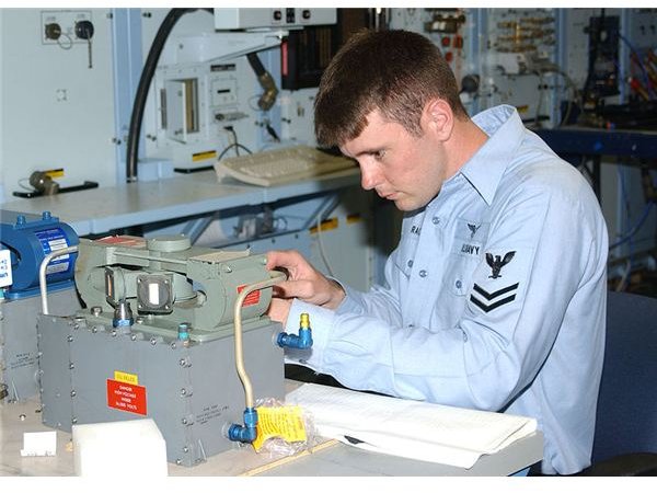 800px-US Navy 030618-N-3970R-011 Aviation Electronic Technician 2nd Class Luke Rachel repairs a field amplifier
