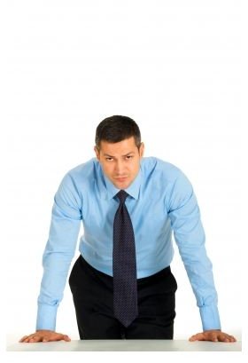 Man leaning on desk