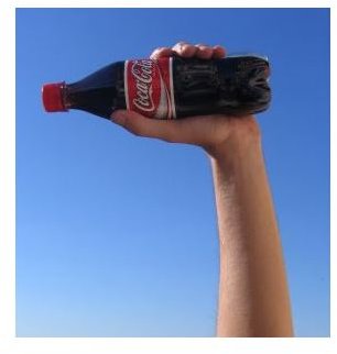 Hand with cola bottle