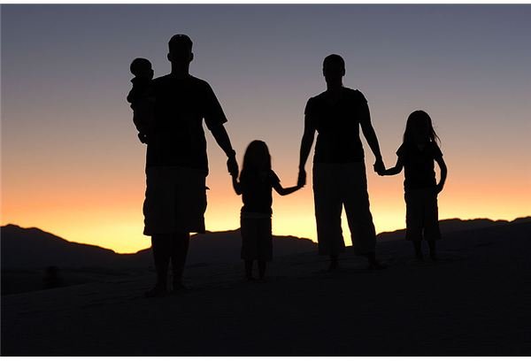 A family silhouetted at sunset.