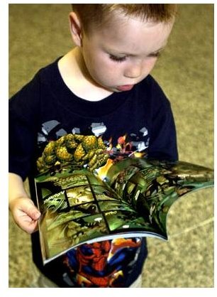 Boy reading marvel comics